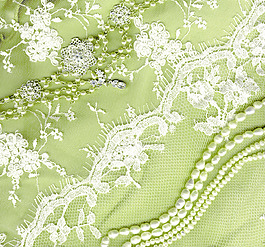 复古婚纱花边在绿色背景纹理