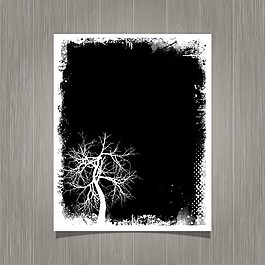 黑色的残破的海报和一棵树