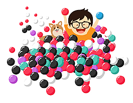 在彩色塑料球里玩耍的小男孩